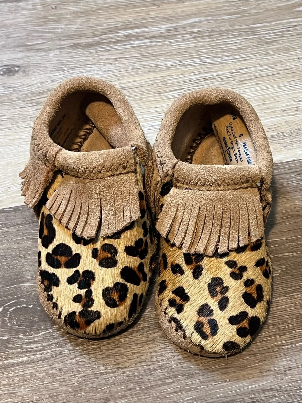 Minnetonka • size 5 • leather Kids Leopard Print Fringe Moccasin Slip-Ons - Tan